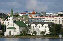 Picture of Icelandic houses on the far side of a lake, August 2003