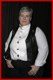 Glenda Rider, wearing a white shirt and black waistcoat