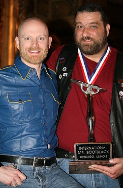 John next to Spot, who's holding the International Mr Bootblack torphy, the night that he won