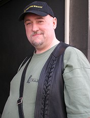 A close up of Daniel Dumont, smiling at the camera