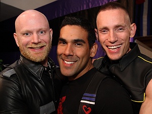 Close up of John, Gary and Mike's heads as they huddle together for the camera