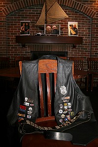 Steve Johnson's leather vest and belt laid out on a chair