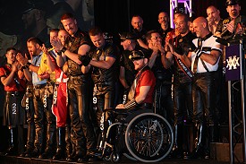 Top 20 contestants lined up at the front of the stage, being appluaded by the other contestants behind them