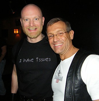 John and Chuck laughing at the camera. John is wearing a t-shirt that says 'I have issues'