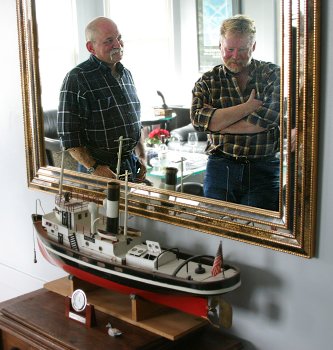 Robert and Joe's reflection in a mirror at their home