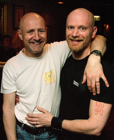 Dave and I hugging each other in the hotel foyer