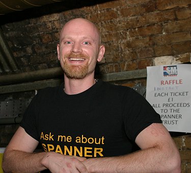 John leaning against a railing inside the Hoist, elated after just finishing his speech at SM Gays 25th Birthday party