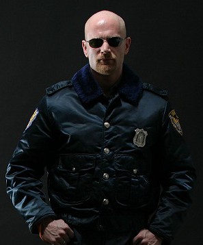 Colour photo of John in a Police uniform