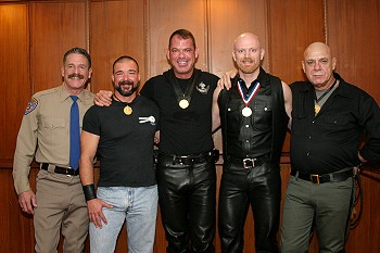 Rene, John, Henk and David stood on the internal staircase of the registry office