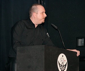 Rick Storer at the podium of the Chicago Theatre