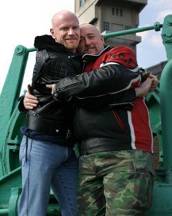 John and Daniel hugging at a mine