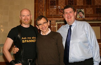 Three men stood shoulder to shoulder, immediately after John's presentation.