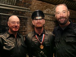 John at a BLUF party with two friends from the United States