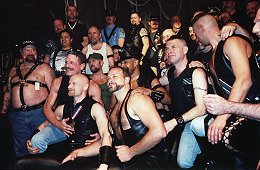 The stage heaves under the weight of titleholders at the Mr Cellblock Leather contest