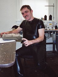 Brett, a leather tailor in Chicago, in his workshop