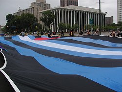 The enormous leather pride flag which we carried in the Pride Parade