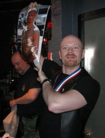 John holding up one of the raffle prizes at Sunday brunch