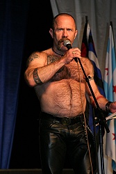 Joe Gallagher giving an appeal for the Leather Archives and Museum on Saturday evening