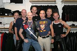 Photo of John with the staff of RoB leather shop, August 2003
