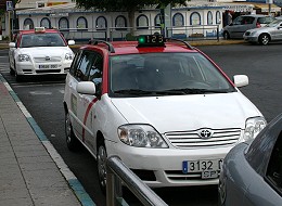 Two taxis waiting in a taxi rank