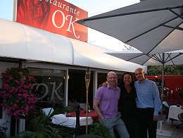 John with the OK Restaurant staff, standing outside the restuarant